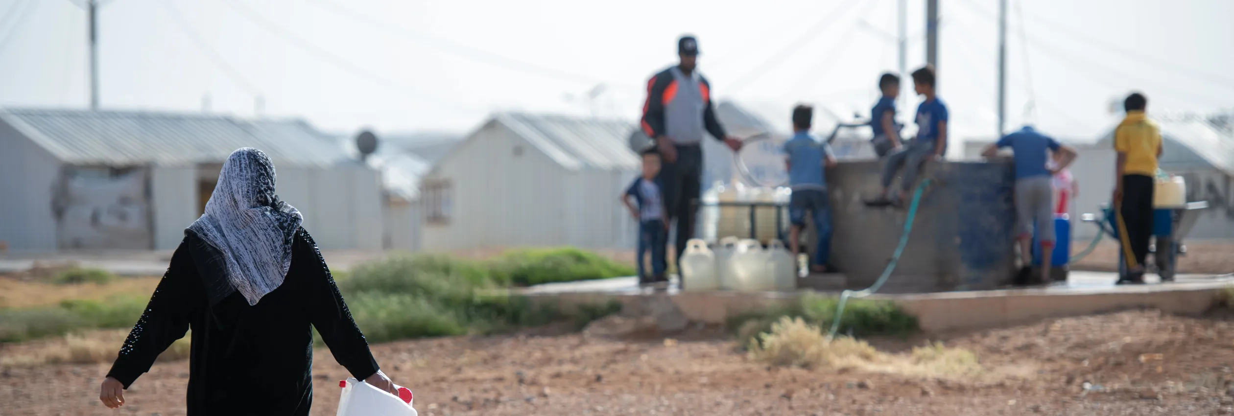 Jordan_Syrian Refugees Collect Water