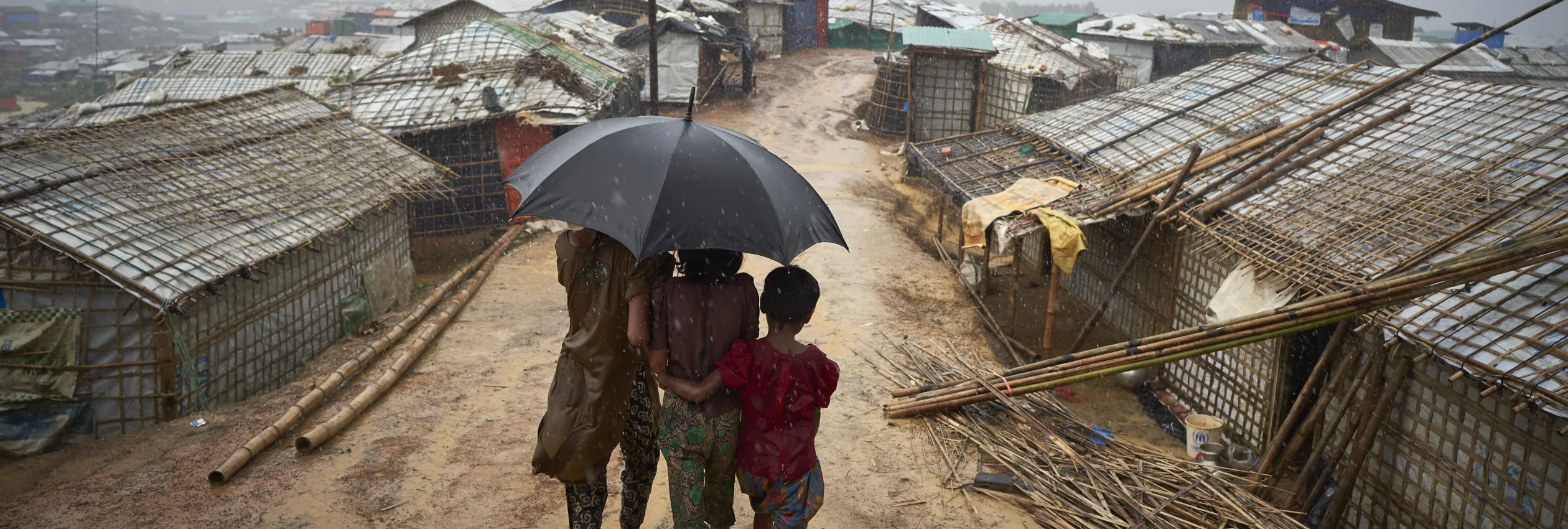 Bangladesh. Rohingya Refugees Walk Through A Heavy Downpour Min