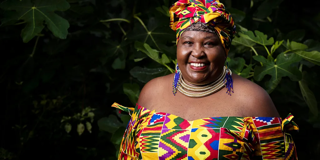 Rosemary, who came to Australia as a refugee from Kenya, poses for a photo at her home in Western Sydney. @UNHCR/Brook Mitchell