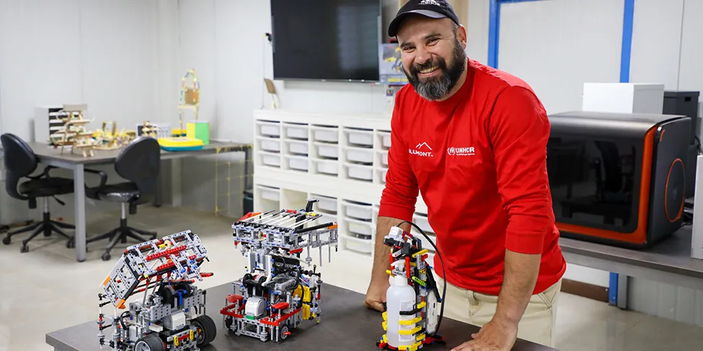 Marwan al-Zoubi and his Lego robot in Za'atari refugee camp