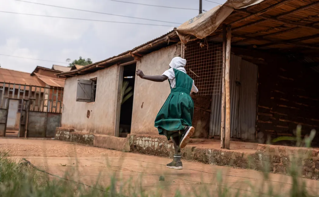 Uganda_Sudanese-Refugee-Leila-Plays-In-The-Yard-Outside-Her-Home-In-Kampala
