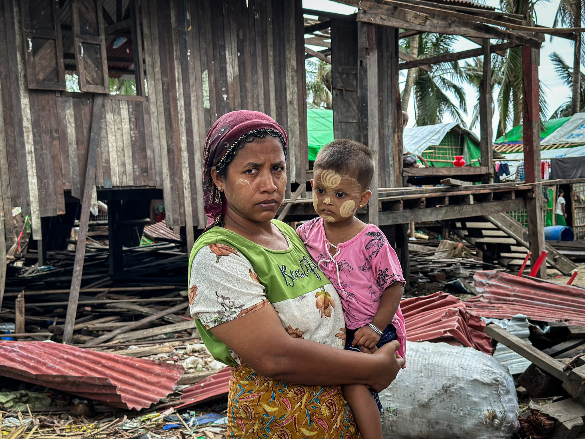 banner_myanmar_woman-and-child-damaged-home-after-cyclone-mocha