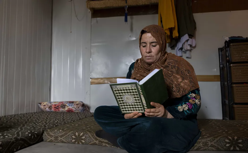 Jordan_Syrian-refugee-Awatef-reads-the-Quran
