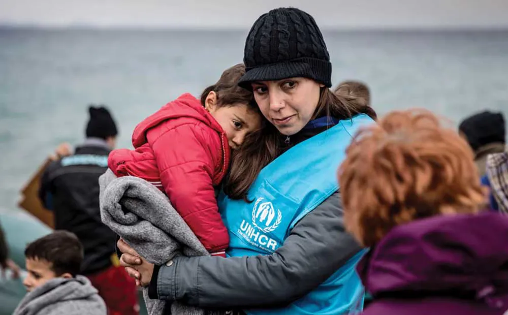 Greece_Comforting-newly-arrived-refugees