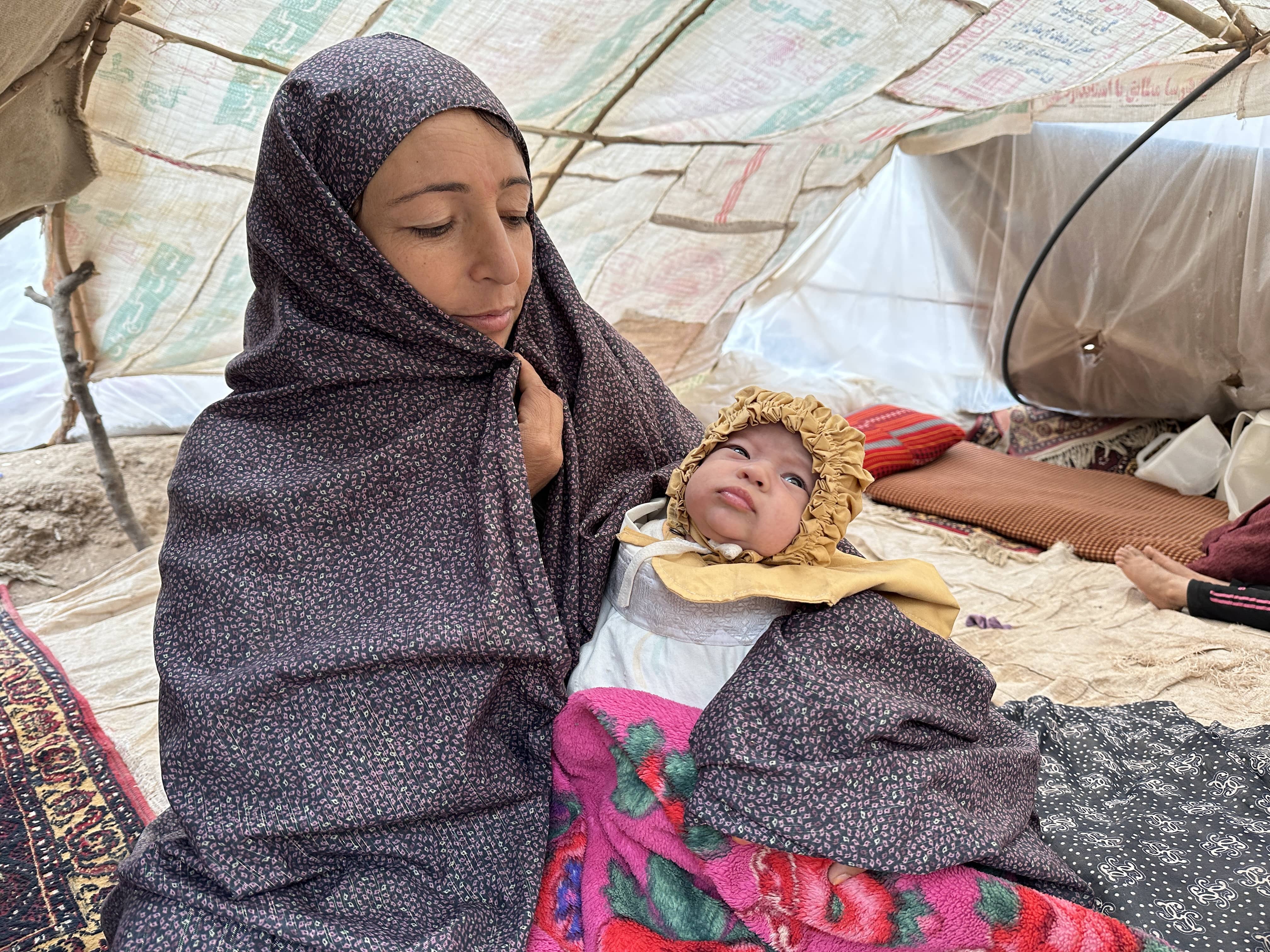 Afghanistan. Humaira, a mother of eight, received a tent and emergency items from UNHCR and partners